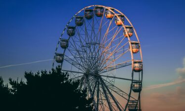 A stunning view of a Ferris wheel silhouetted against a twilight sky in Bournemouth, England.