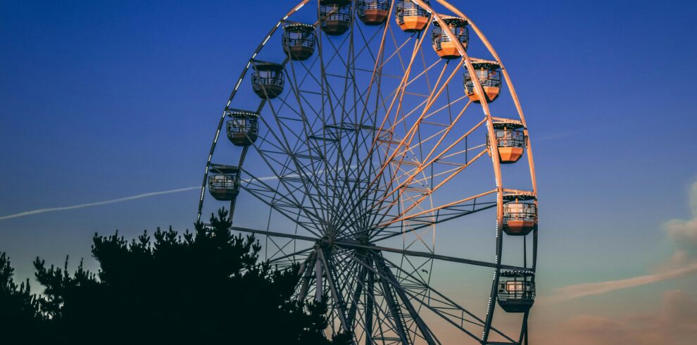 A stunning view of a Ferris wheel silhouetted against a twilight sky in Bournemouth, England.